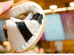 Close-up showing the extreme flexibility and soft rubber sole of baby walking shoes