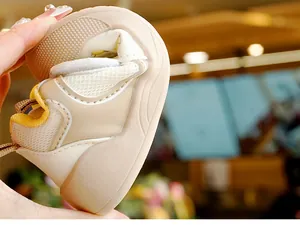 Detail showing high flexibility of baby walking shoes with soft breathable mesh material