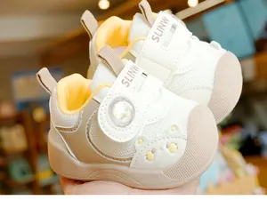 Close-up of baby walking shoe with breathable mesh and cute bear embroidery detail