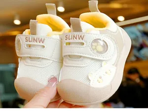 Detailed macro view of breathable mesh toddler shoes with protective toe and cartoon bear
