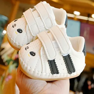 White baby walking shoes with soft non-slip soles and cute cartoon embroidery