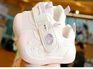 Close-up of pink toddler shoes featuring breathable mesh and cute 3D cartoon bear detail