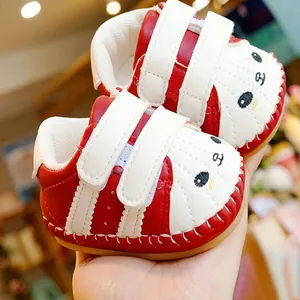 Red and white baby walking shoes with soft soles and cute cartoon bear velcro straps