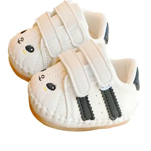 White baby walking shoes with soft non-slip sole and cute cartoon bear embroidery