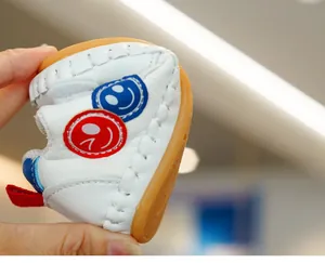 Close-up of flexible soft sole baby shoes showing excellent flexibility and folding ability