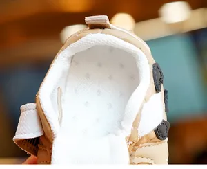 Detail view of baby walking shoe showing breathable mesh lining and soft padded collar