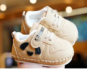 Detail of baby soft sole walker shoe with khaki quilted leather and panda face design