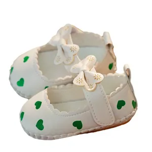 White baby girl princess walker shoes with green heart pattern and bow straps