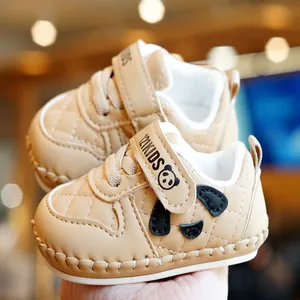 Soft-sole beige baby walking shoes with cute panda decor and quilted faux leather texture