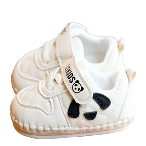 White soft-sole baby walking shoes with panda patch and quilted design for infants
