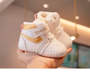 Macro detail of plush fleece lining and velcro closure on white infant winter walking shoes