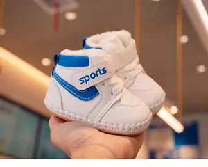 Detail of baby winter walker shoes with warm fleece lining and blue leather patchwork