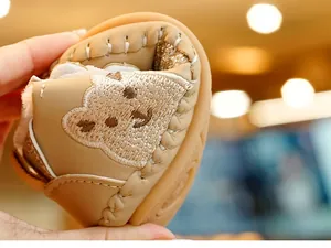 Detail of baby soft-sole walker shoe showing high flexibility and warm plush fleece lining
