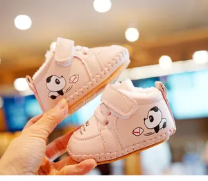 Close-up of pink baby shoes with panda print, warm fleece lining and velcro strap