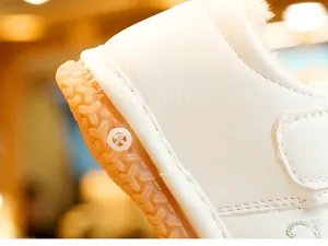Macro shot of non-slip rubber sole and plush warm lining on winter baby walking shoes