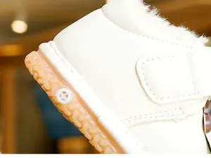 Detailed macro of baby winter shoes with warm faux fur lining and anti-slip rubber sole