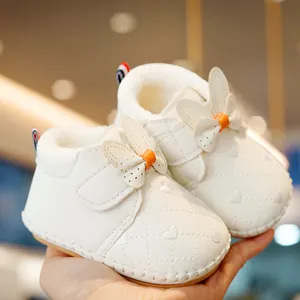 Winter plush baby shoes in cream white with heart embroidery and cute bow accent