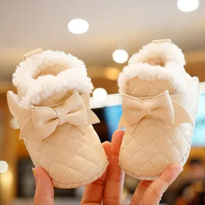 Plush winter baby girl walking shoes in cream white with quilted pattern and bow