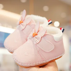 Pink soft-sole baby boots with quilted heart pattern and warm plush lining for toddlers