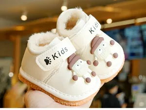 Detailed view of warm winter baby shoes with plush lining and cute cartoon character