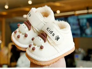 Detail of warm winter toddler boots with plush lining and cute cartoon character decor