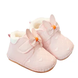 Pink fleece baby walking shoes with cute rabbit ears and non-slip soft soles