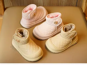 Detailed close-up of warm plush lining and quilted PU texture on winter baby boots