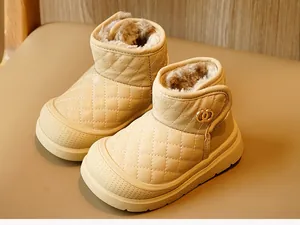 Detail of cream toddler winter boots with quilted leather and plush faux fur lining