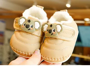Close-up of khaki baby winter shoes with soft fleece lining and 3D koala detail