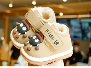 Detail of warm khaki winter toddler boots with thick plush lining and velcro closure