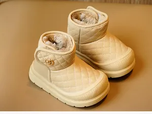 Detail view of quilted beige toddler snow boots with plush faux fur lining and non-slip sole