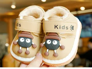 Detail of warm khaki baby winter boots with thick faux shearling lining and non-slip sole