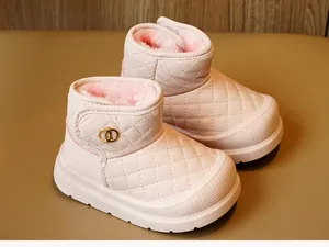 Macro detail of pink toddler snow boots with quilted faux leather and plush lining