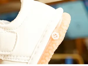 Detailed view of baby walking shoes with reinforced stitching and non-slip rubber soles