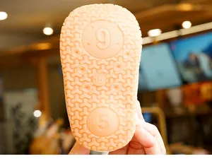 Detail of soft anti-slip rubber sole with Y-pattern grip for infant walking shoes