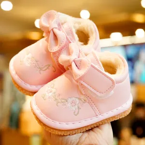 Pink winter toddler walking shoes with floral embroidery and warm faux fleece lining