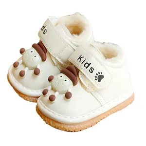Winter warm plush toddler shoes in white leather with cute cartoon design and soft rubber sole