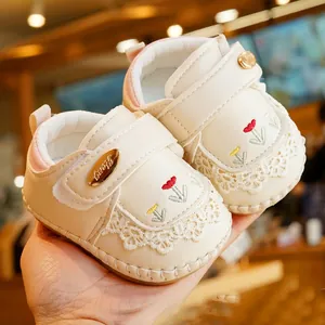 Soft-soled baby walking shoes with tulip embroidery and lace trim in cream white color