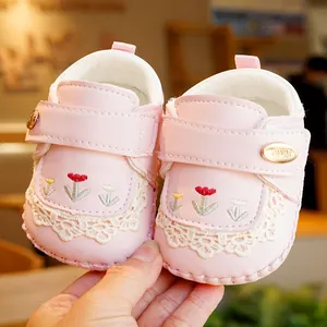 Pink baby walking shoes with tulip embroidery, white lace trim and soft non-slip soles