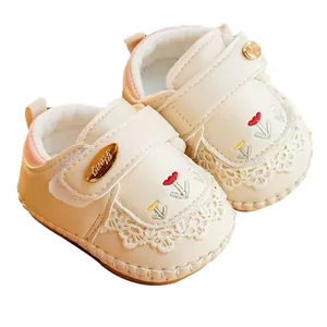 Soft-sole baby walker shoes in creamy white with floral embroidery and lace trim