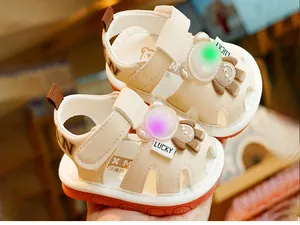 Detail of toddler sandals with soft anti-slip soles and glowing LED light features