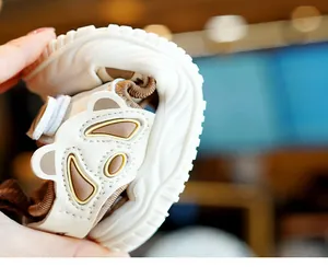 Close-up showing the flexible non-slip rubber sole of the panda baby summer sandals