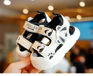 Detail of baby summer sandal with panda ears and hook-and-loop strap closure