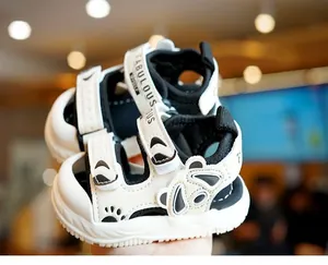 Detail shot of baby panda sandals with double velcro straps and anti-slip thick soles