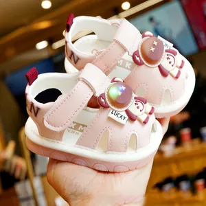 Pink toddler LED sandals with cartoon astronaut design and non-slip rubber soles
