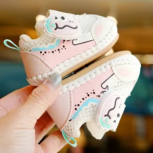 Pink breathable mesh baby walking shoes with soft soles and cute cartoon dinosaur decor