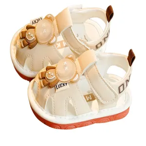 Cream toddler sandals with cute bear detail and orange anti-slip rubber soles