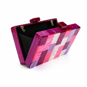 Women's acrylic evening clutch featuring pink and purple geometric marble patchwork design