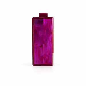 Detail of hot pink marble acrylic clutch bag with a sleek rectangular metal top clasp