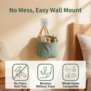 Strong adhesive wall hook holding a green fabric storage basket in a bedroom setting